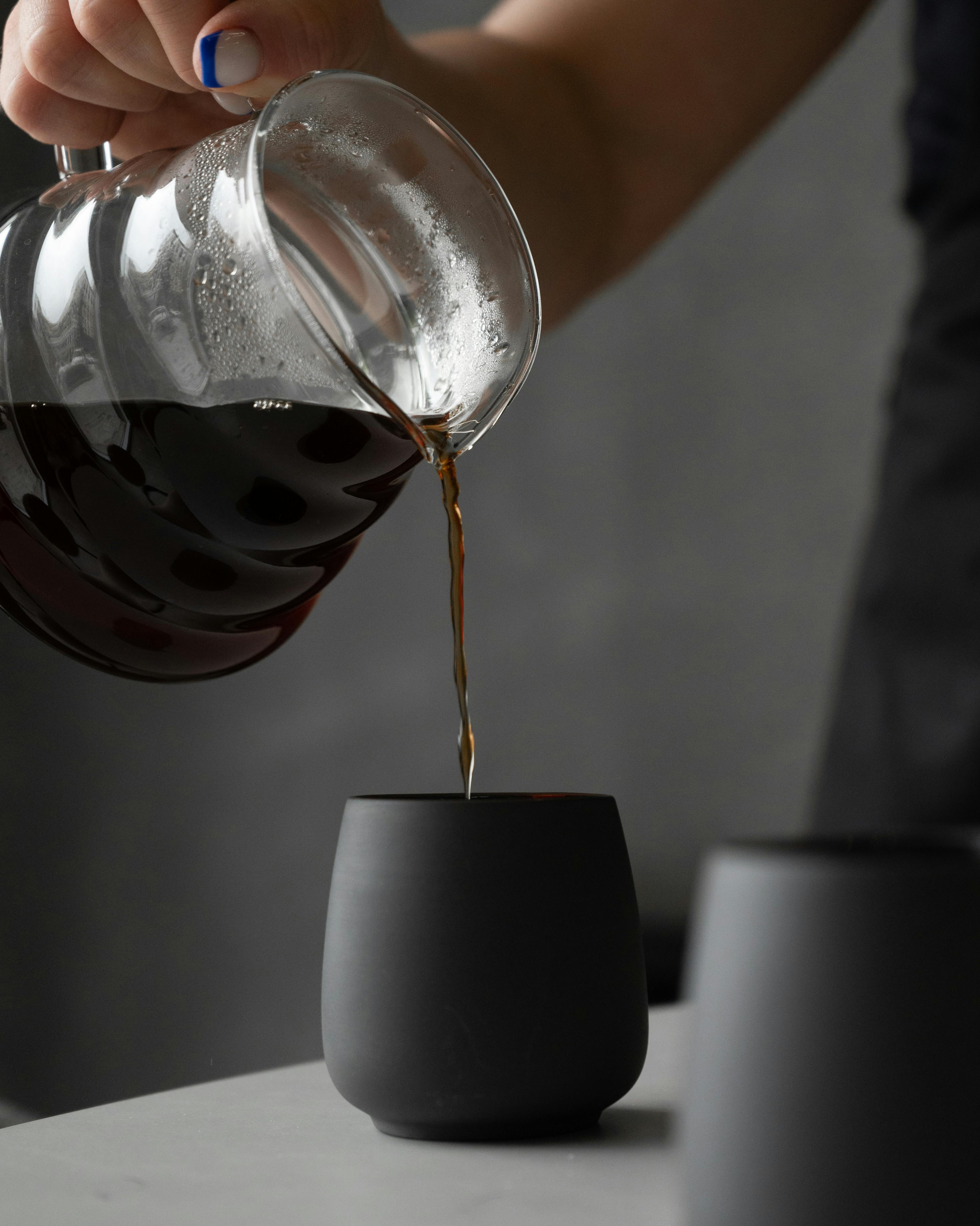 Pouring coffee into a cup